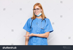 stock-photo-pretty-woman-smiling-cheerfully-feeling-happy-and-showing-a-concept-in-copy-space-with-palm-of-2003901812.jpg