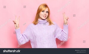 stock-photo-red-head-pretty-woman-smiling-and-looking-happy-friendly-and-satisfied-gesturing-victory-or-peace-2088181471.jpg