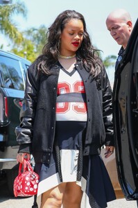 rihanna-in-varsity-jacket-puma-sneakers-and-a-bright-red-louis-vuitton-bag-in-los-angeles-06-16-2023-1.jpg