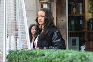 rihanna-in-varsity-jacket-puma-sneakers-and-a-bright-red-louis-vuitton-bag-in-los-angeles-06-16-2023-2.jpg