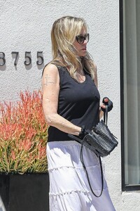 melanie-griffith-shows-off-her-new-tattoo-out-in-los-angeles-07-10-2023-5.jpg
