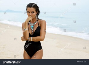 stock-photo-beautiful-and-sexy-woman-on-the-beach-wearing-silver-jewelry-654011848.jpg