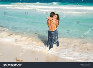 stock-photo-beautiful-couple-in-embrace-on-the-beach-444729538.jpg