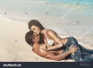 stock-photo-beautiful-couple-in-embrace-on-the-beach-444729556.jpg