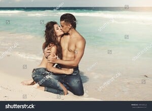 stock-photo-beautiful-couple-in-embrace-on-the-beach-444729562.jpg