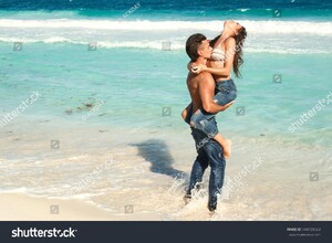 stock-photo-beautiful-couple-in-embrace-on-the-beach-444729583.jpg