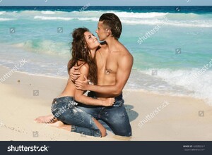 stock-photo-beautiful-couple-in-embrace-on-the-beach-480202687.jpg
