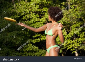 stock-photo-beautiful-woman-of-african-american-origin-throwing-a-frisbee-disc-46956436.jpg