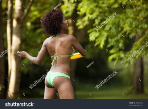 stock-photo-beautiful-woman-of-african-american-origin-throwing-a-frisbee-disc-46956445.jpg