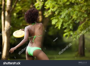 stock-photo-beautiful-woman-of-african-american-origin-throwing-a-frisbee-disc-46956448.jpg