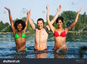 stock-photo-group-of-friends-man-and-to-women-stretching-arms-in-the-water-of-a-lake-on-a-hot-summer-day-35661703.jpg
