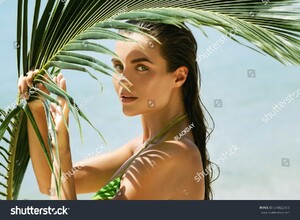 stock-photo-portrait-of-beautiful-woman-with-shadows-of-palm-leaf-on-her-face-670822705.jpg