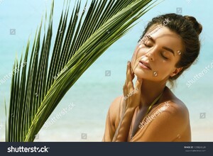 stock-photo-portrait-of-beautiful-woman-with-shadows-of-palm-leaf-on-her-face-739824520.jpg