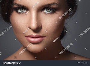 stock-photo-portrait-of-young-woman-with-beautiful-makeup-316311425.jpg