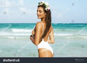 stock-photo-sexy-woman-in-white-swimsuit-is-posing-on-the-beach-661553290.jpg