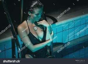 stock-photo-sexy-woman-wearing-black-swimsuit-in-the-pool-at-night-1039822534.jpg
