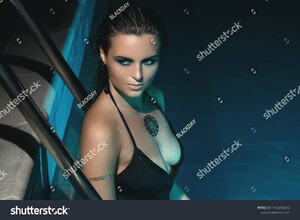 stock-photo-sexy-woman-wearing-black-swimsuit-in-the-pool-at-night-1105478012.jpg