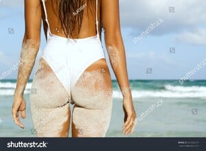 stock-photo-woman-with-sexy-buttocks-on-the-beach-661555717.jpg