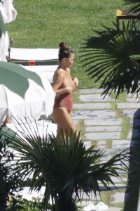 chrissy-teigen-in-swimsuit-at-a-swimming-pool-in-lake-como-09-14-2023-3.jpg