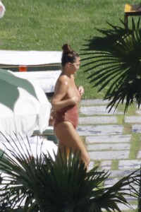 chrissy-teigen-in-swimsuit-at-a-swimming-pool-in-lake-como-09-14-2023-6.jpg