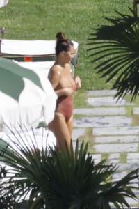 chrissy-teigen-in-swimsuit-at-a-swimming-pool-in-lake-como-09-14-2023-9.jpg