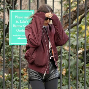 irina-shayk-in-black-leather-hot-pants-black-stockings-black-boots-and-maroon-jacket-out-in-new-york-12-04-2023-3.jpg