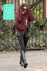 irina-shayk-in-black-leather-hot-pants-black-stockings-black-boots-and-maroon-jacket-out-in-new-york-12-04-2023-4.jpg