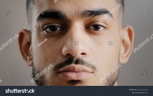 stock-photo-close-up-portrait-of-hispanic-indian-male-serious-young-student-man-freelancer-model-stand-indoor-2156765191.jpg