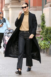 karlie-kloss-in-a-tan-turtleneck-black-jeans-and-black-overcoat-in-nyc-12-08-2023-2.jpg