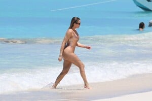 khloe-kardashian-in-metallic-one-piece-swimsuit-in-the-turks-and-caicos-04-03-2024-0.jpg