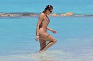 khloe-kardashian-in-metallic-one-piece-swimsuit-in-the-turks-and-caicos-04-03-2024-5.jpg