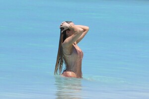 khloe-kardashian-in-metallic-one-piece-swimsuit-in-the-turks-and-caicos-04-03-2024-7.jpg