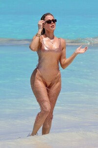 khloe-kardashian-in-metallic-one-piece-swimsuit-in-the-turks-and-caicos-04-03-2024-8.jpg