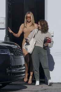 khloe-kardashian-wearing-a-short-fitted-beige-dress-in-los-angeles-04-12-2024-4.jpg