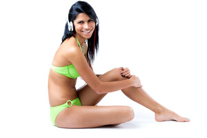 happy-young-girl-with-green-bikini-listening-music.jpg