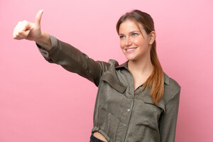 young-caucasian-woman-isolated-pink-background-giving-thumbs-up-gesture.jpg