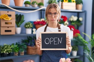 young-caucasian-woman-working-florist-with-open-sign-depressed-worry-distress-crying-angry-afraid-sad-expression.jpg