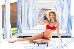 young-woman-straw-hat-relaxing-daybed-near-luxurious-summer-pool.jpg