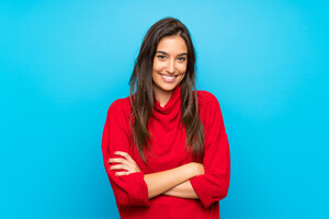 young-woman-with-red-sweater-isolated-blue-laughing.jpg