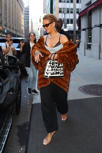 rihanna-dazzles-in-nyc-with-chic-curly-hair-and-bold-fashion-statement-7.jpg