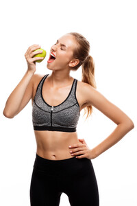 beautiful-sportive-woman-posing-holding-apple (1).jpg