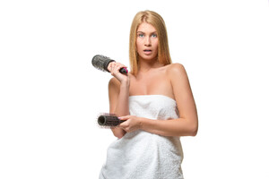 44765864_young-blond-woman-in-towel-holding-a-combs.jpg