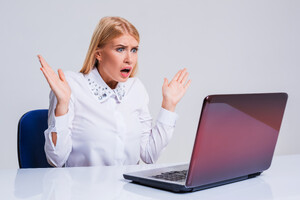 56692234_young-businesswoman-working-at-laptop-computer.jpg