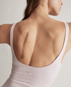 Birgit Kos has a fit and sexy back in a onesie lavender.jpg