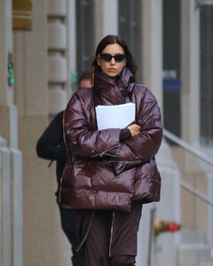 irina-shayk-in-a-plum-colored-puffer-coat-dark-brown-pants-and-sleek-black-boots-out-in-new-york-10-28-2024-1.jpg
