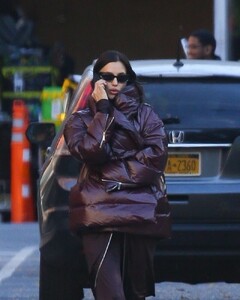 irina-shayk-in-a-plum-colored-puffer-coat-dark-brown-pants-and-sleek-black-boots-out-in-new-york-10-28-2024-2.jpg