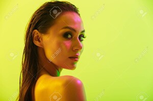 130006805-side-view-portrait-of-an-attractive-young-woman-posing-isolated-over-yellow-wall-background-with.thumb.jpg.49d2b282a3a9c590ad0d1d276251e49e.jpg