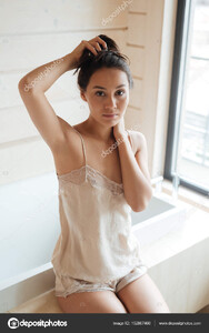 depositphotos_152807460-stock-photo-beautiful-young-woman-sitting-at.jpg