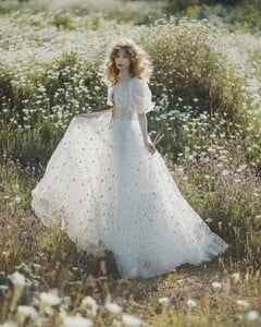 An endless white field of possibilities ✨I love summer for its golden-green hues and tall grass — it feels like stepping into a fairytale. 🌿 Photo @jovanarikalo Model @vanjajagnic Dress @teutamatoshi More of  (2).jpg
